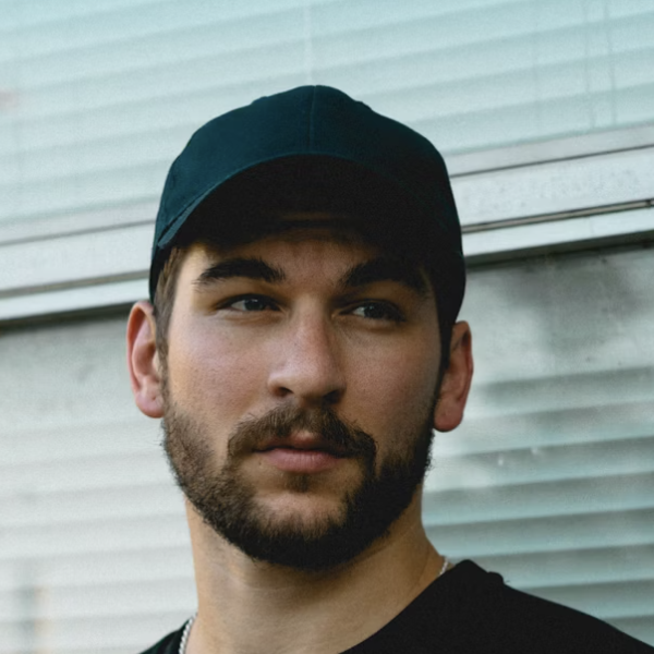 Man wearing dark baseball cap